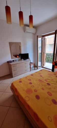 a bedroom with a large bed and a mirror at PraiadAmare in Praia a Mare
