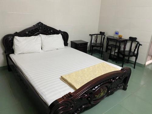 Voodi või voodid majutusasutuse Khách sạn AMI toas