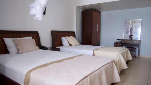 En eller flere senge i et værelse på Océanis Hotel
