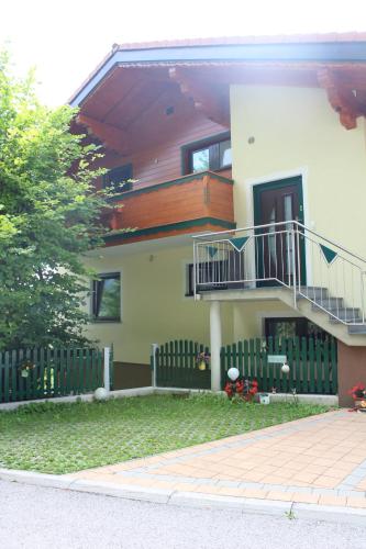 a house with a staircase on the side of it at Mountain-View in Ramsau am Dachstein