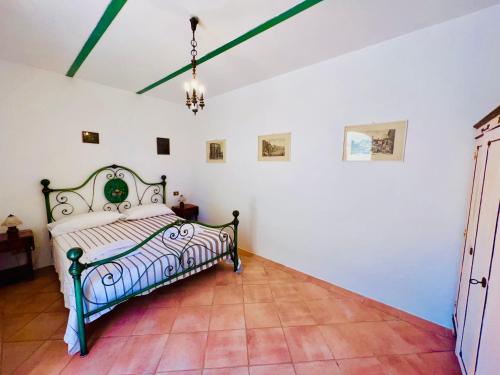 a bedroom with a bed in a room at IL BORGHETTO di ANSEDONIA in Ansedónia