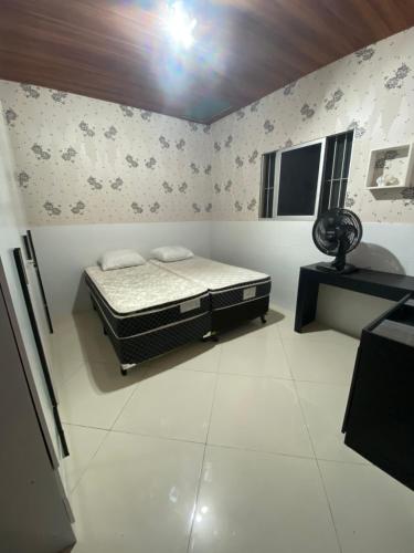 Llit o llits en una habitació de Casa ACONCHEGO no Centro de Bananeiras.