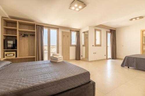 Room Salento Palace 2 tesisinde bir odada yatak veya yataklar
