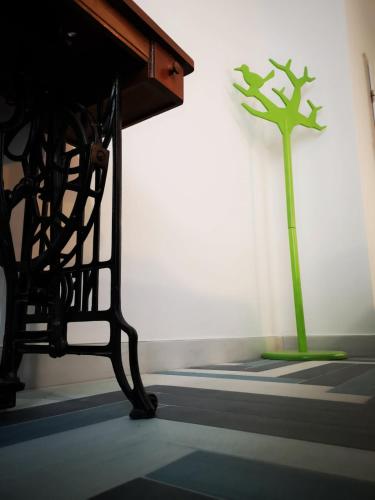 a sculpture of a tree in a room at Cres B studio apartman in Cres