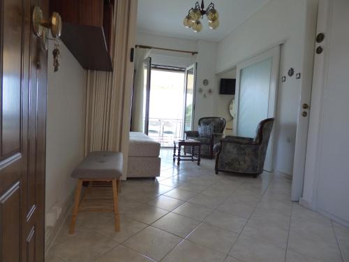 a living room with a couch and a chair at Bay view apartment in Malaki