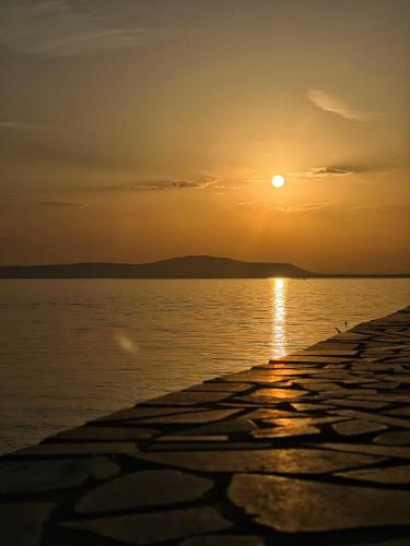 a sunset over a body of water at Agriturismo Morus Alba Gargano in Foce Varano