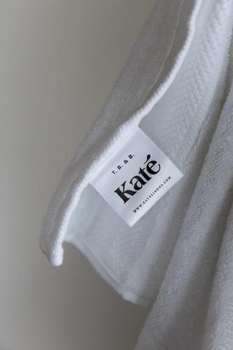 a white shirt with a tag on the side of it at Casa Mirame in Carmen
