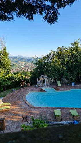 a large swimming pool in a yard at Convento Di San Martino in Crocicchio in Urbino