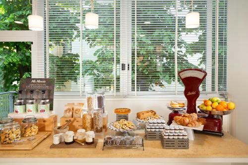 a table with bread and other food items on it at Hotel Cristallo in Riccione