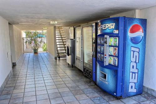 a blue pepsi machine sitting next to a hallway at Motel 6 San Simeon, CA - Hearst Castle Area in San Simeon