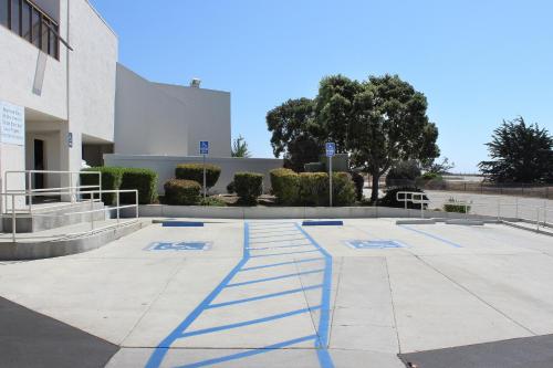 
a parking lot with a parking meter and a building at Motel 6-San Simeon, CA - Hearst Castle Area in San Simeon
