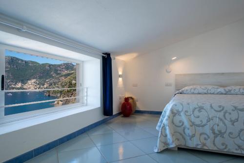 En eller flere senge i et værelse på La Mansarda