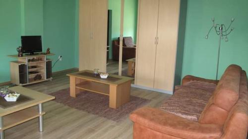 a living room with a couch and a table at Lelita in Bela Crkva