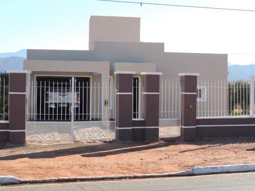 a building with two doors and a fence at Casa Quinta in Villa Unión