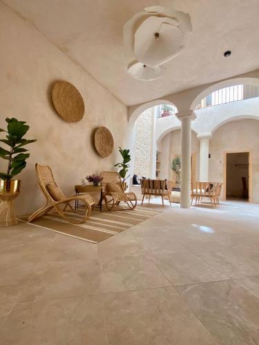 a large room with chairs and tables and a ceiling at VICTORIA - by Ático73 in Medina Sidonia