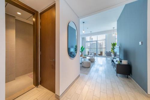 an open hallway with a door and a living room at EDEN'S Homes & Villas - Atria Residences in Dubai