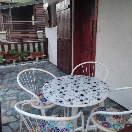a table and chairs sitting on a patio at BAH house in Kolašin