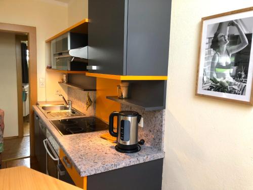 a kitchen with a coffee maker on a counter at Ferienhaus Mautzfried in Reisach
