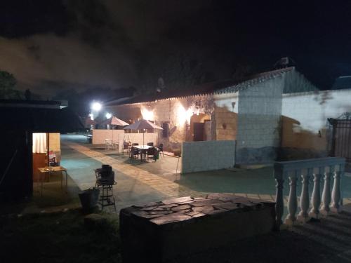 a house lit up at night with lights on it at Los Duendes in El Puerto de Santa María