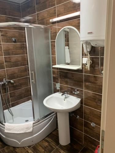 a bathroom with a shower and a sink at Apartment Dunja in Boreti