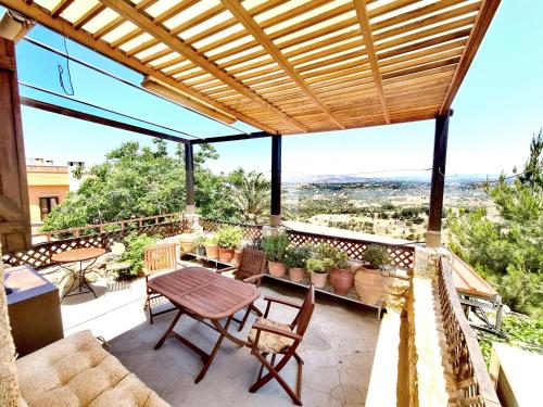 A balcony or terrace at Virginia - Peaceful Traditional House
