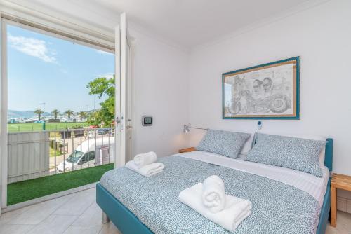 a bedroom with a bed and a large window at Bella Vista KTH in Trogir