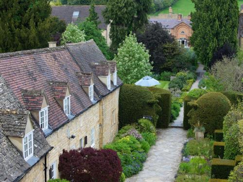 a view of a house with a garden at Cotswold House Hotel and Spa - "A Bespoke Hotel" in Chipping Campden