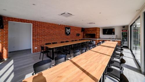 a large room with a long table and chairs at Villa Hills in Bijeljina