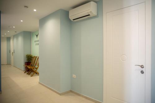 a hallway with a white air conditioner on a wall at Veranda Boutique Hotel in Vlorë