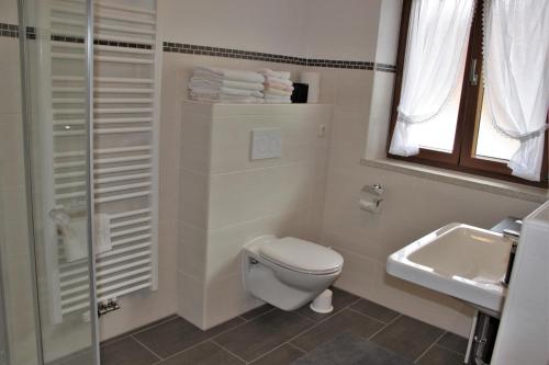 a bathroom with a toilet and a sink at Obergöbllehen in Schönau am Königssee