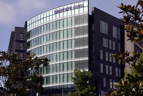 a building with a marriott hotel sign on it at Mercure Clermont Ferrand centre Jaude in Clermont-Ferrand