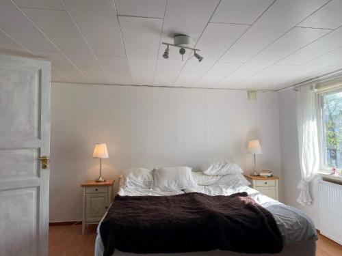 Postel nebo postele na pokoji v ubytování Holiday home Trollhättan II