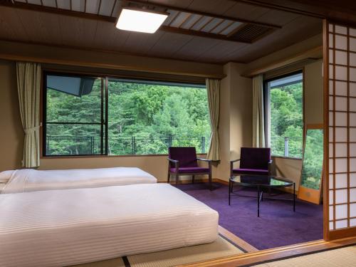 Postel nebo postele na pokoji v ubytování KAMENOI HOTEL Nikko Yunishigawa All-Inclusive Resort