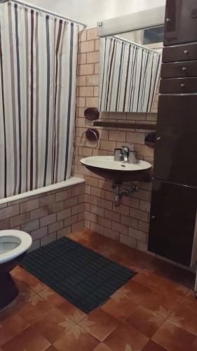 a bathroom with a sink and a shower and a toilet at House Branka in Kampor