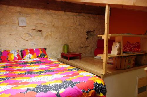 Maison d'Hôtes Lou Cliou tesisinde bir odada yatak veya yataklar