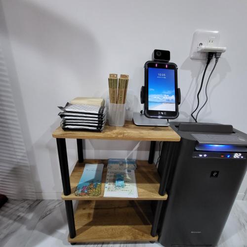 a desk with a laptop and a computer on it at 3ベッド3バス ヴィラアパラギ宮古島 in Miyako Island