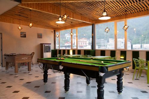 a billiard room with a pool table in it at Hotel Dream Inn in Rishīkesh