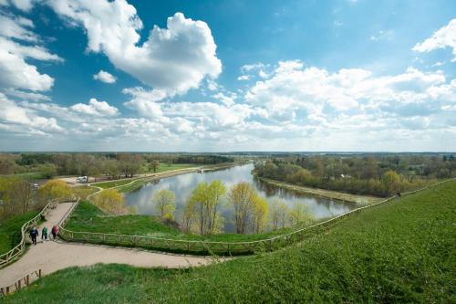 a view of a river from the top of a hill at Kraina Bugu - anielski dom z bezposrednim zejsciem do rzeki in Repki