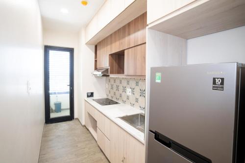 Kuchyň nebo kuchyňský kout v ubytování Sline Hotel and Apartment