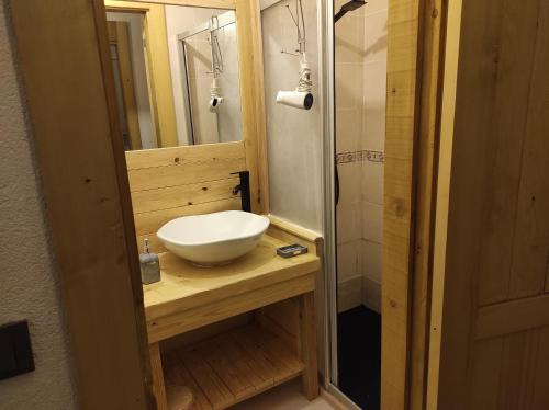 a bathroom with a white sink and a mirror at Rentavill Villa Zeus in Bodrum City