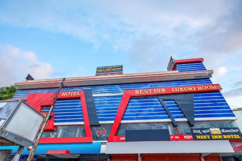 a blue building with red and blue paint on it at Octave Nest Inn in Bengaluru