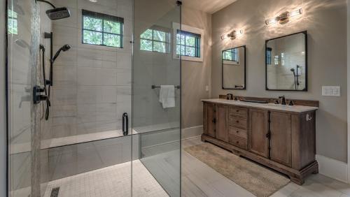 a bathroom with a shower and a sink at Bunker Down in Mineral Bluff