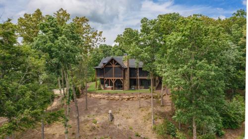an aerial view of a house in the woods at Bunker Down in Mineral Bluff