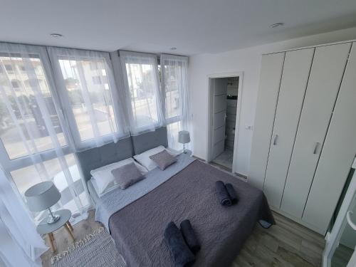 Postel nebo postele na pokoji v ubytování Apartman Svitogor
