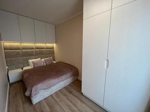 Katil atau katil-katil dalam bilik di Dziwnów Gardenia Seaside - apartament Pola z widokiem na morze