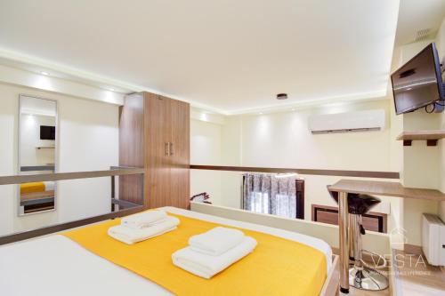 Postel nebo postele na pokoji v ubytování Dahlia City Loft-Apartment, Vesta Philoxenia