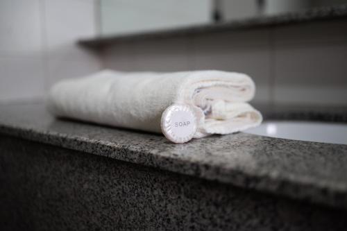 a roll of toilet paper sitting on top of a counter at Grand Hotel in Liawan