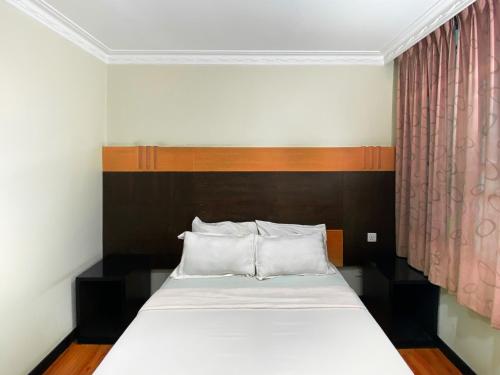 Postel nebo postele na pokoji v ubytování Grand Hotel