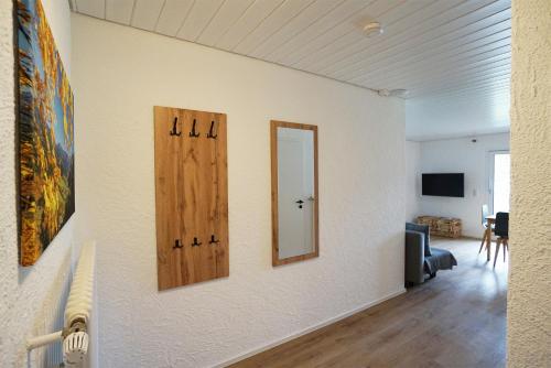 a room with two doors and a mirror on a wall at Höllkopf - Stubenhof, Black Forest in Simonswald