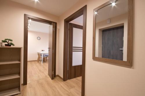 a hallway with two doors and a dining room at Academy Apartment Cieszyn in Cieszyn
